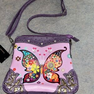 NWT cowgirl trendy cross body bag. Lots of butterflies